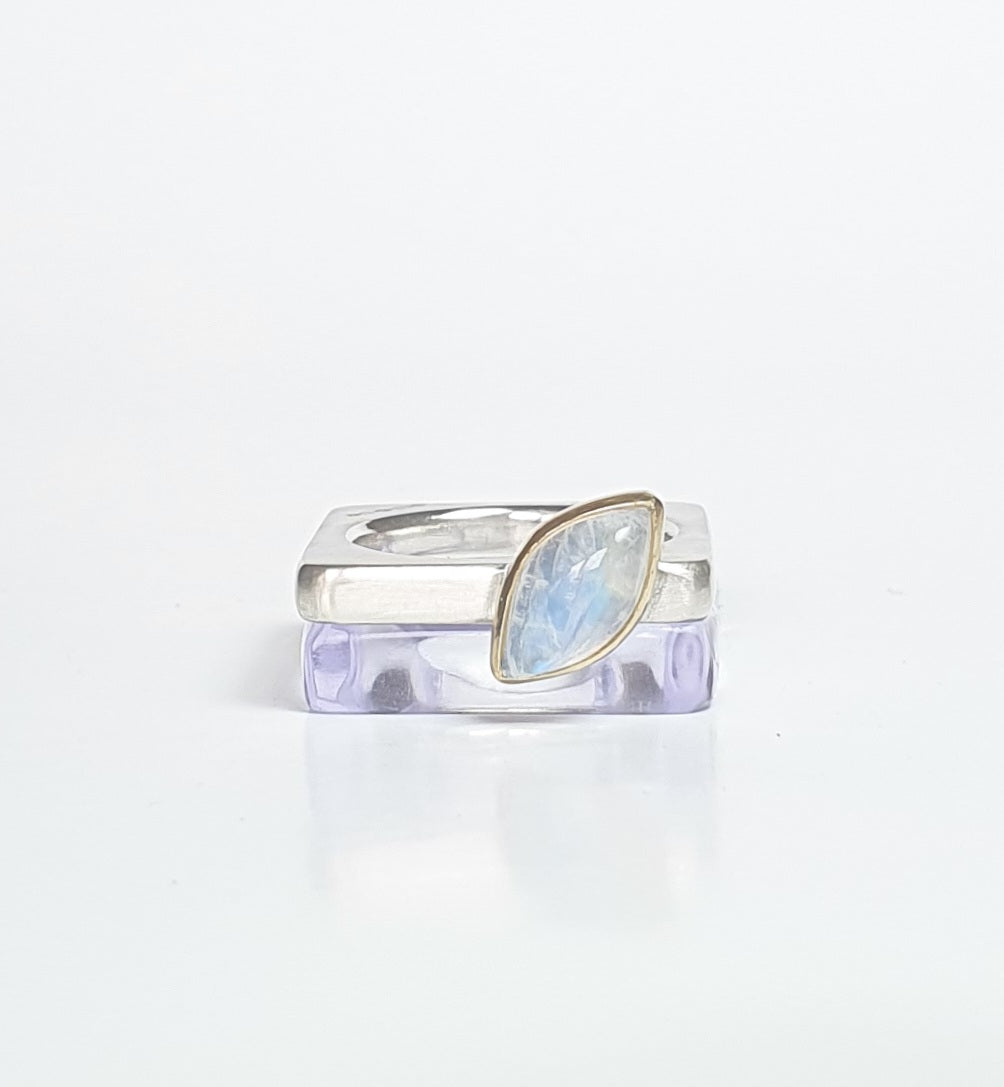 Violet perspex square stacking ring stacked with moonstone silver ring. barbara Spence Jewellery