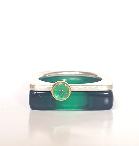 Pair of square rings. A thin silver one with a vivid green cabochon emerald. Perspex ring in deep bottle green. #BarbaraSpenceJewellery