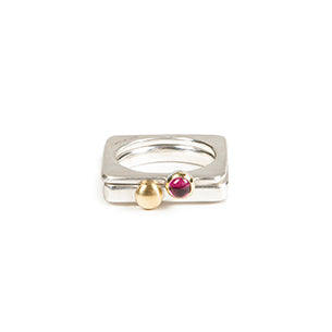 A square silver ring with a pretty cabochon set in gold.