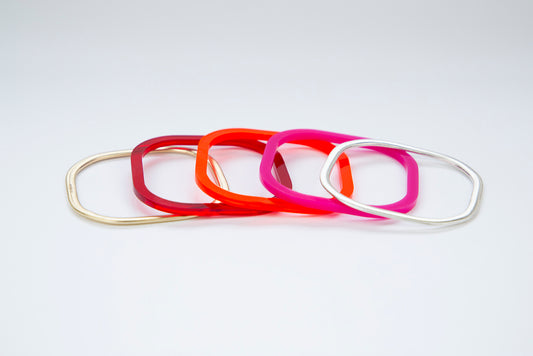 Range of red acrylic, silver and gold bangles www.barbaraspence.co.uk