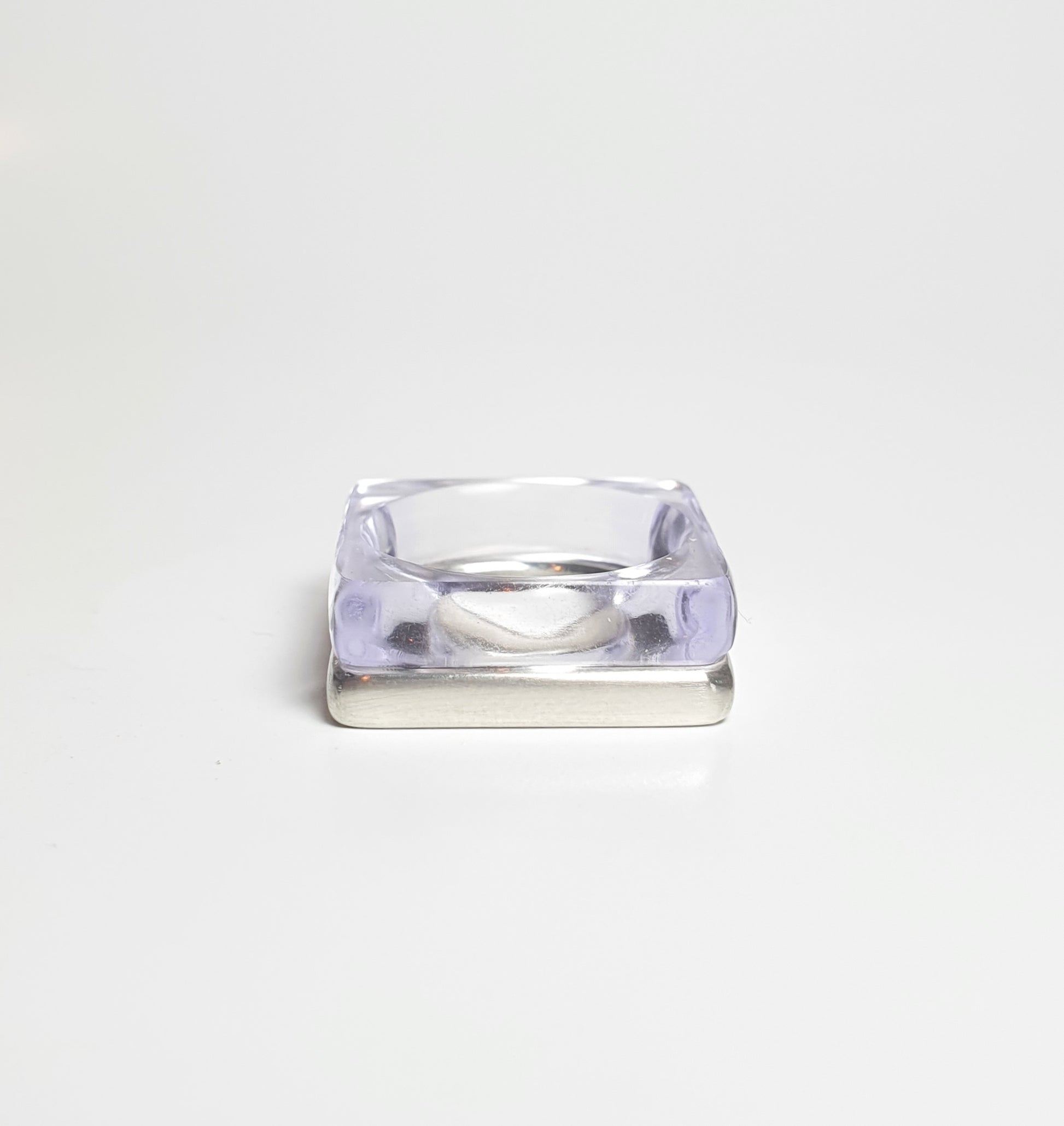 Violet perspex square stacking ring stacked with heavy silver ring. barbara Spence Jewellery