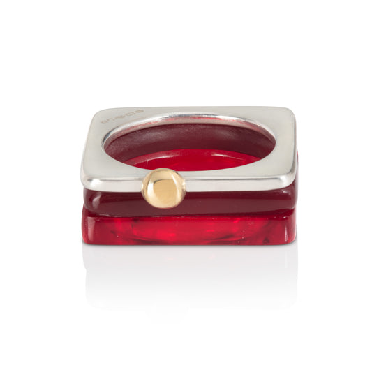 Set of square rings featuring (from bottom) dark red, chocolate brown, silver with gold ball. BarbaraSpence.co.uk
