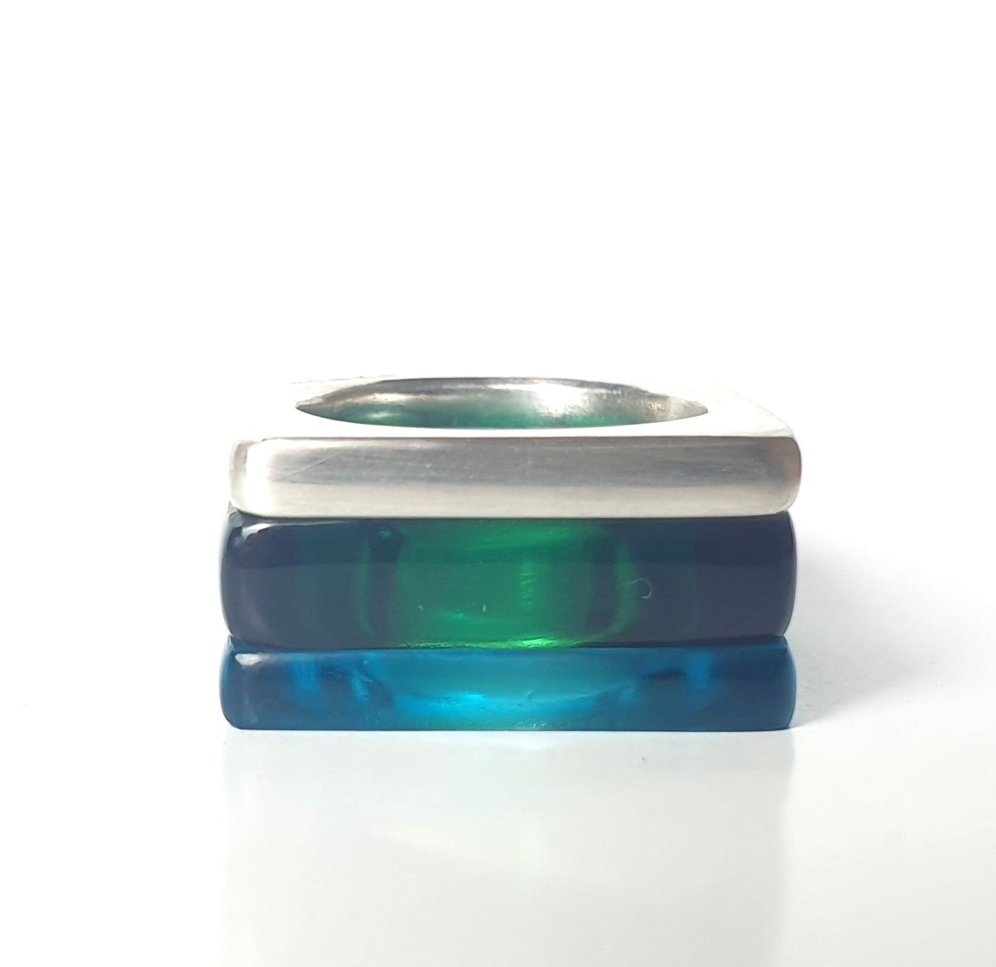 Square rings in bottle green and azure perspex with a thick silver ring
#BarbaraSpenceJewellery