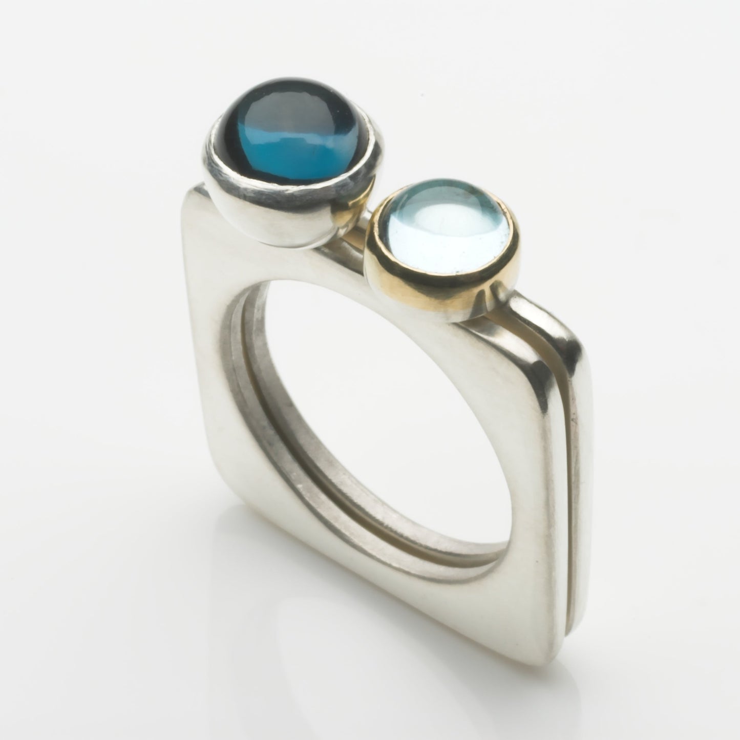 Square stacking rings: 6mm pale topaz set in gold with London blu topaz set in silver cup