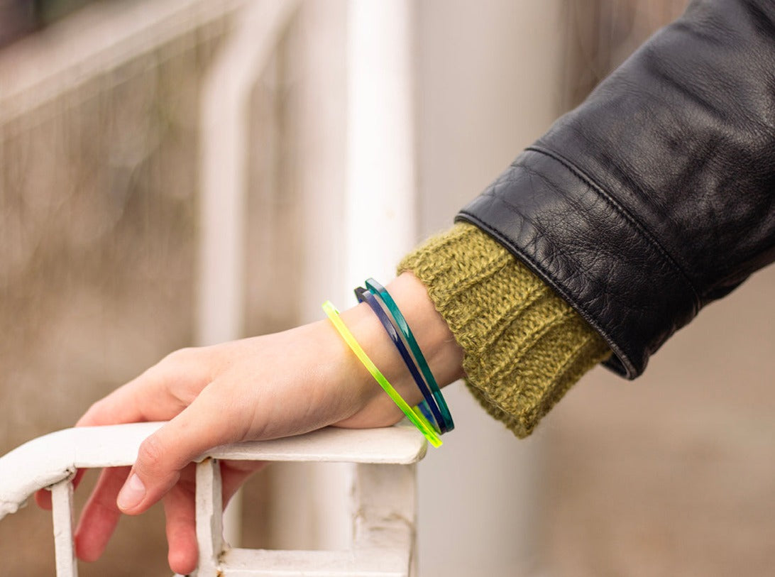 Square perspex bangles in acid green, sapphire and azure, modelled by Holly www.barbaraspence.co.uk