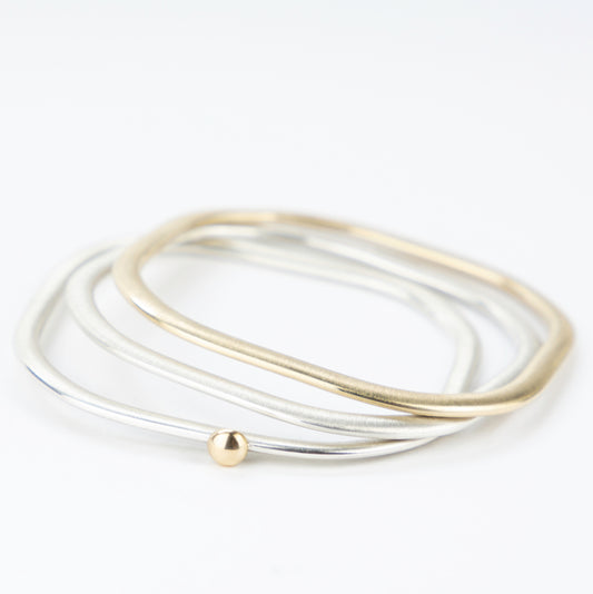 Square silver bangle with gold ball stacked with silver and gold bangles www.barbaraspence.co.uk