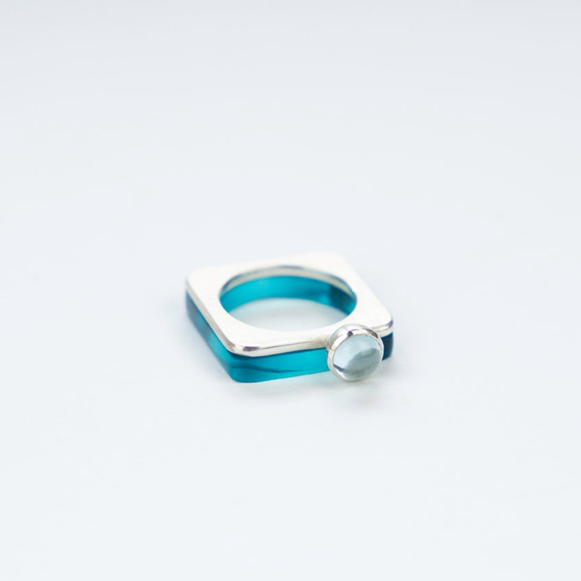 Square ring in azure perspex stacked with silver ring with pale topaz www.barbararspence.co.uk
