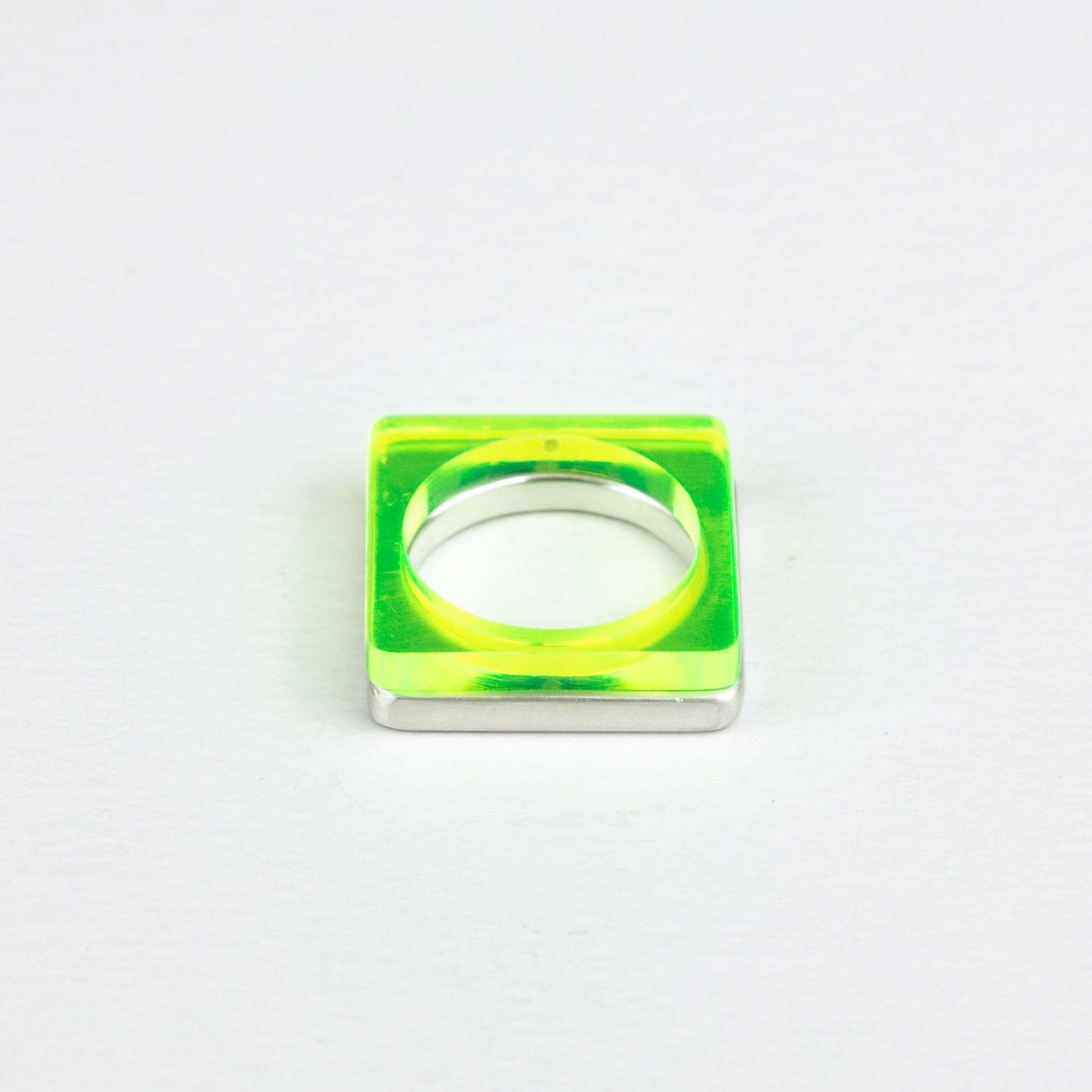 Square ring in acid green perspex stacked with heavy square silver ring www.barbaraspence.co.uk