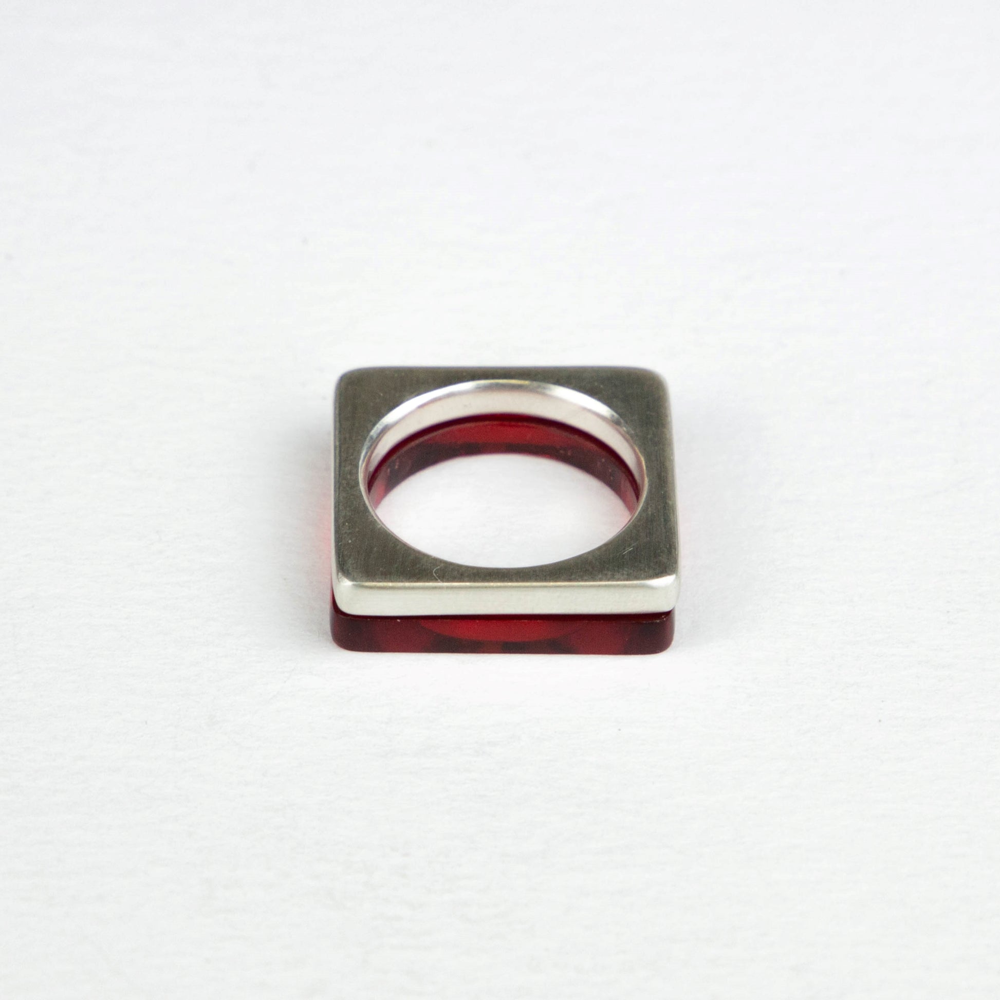 Dark red perspex ring stacked with heavy square silver ring www.barbaraspence@hotmail.co.uk