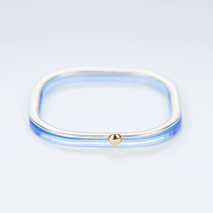 Square silver bangle with gold ball stacked with neptune acrylic bangle www.barbaraspence.co.uk