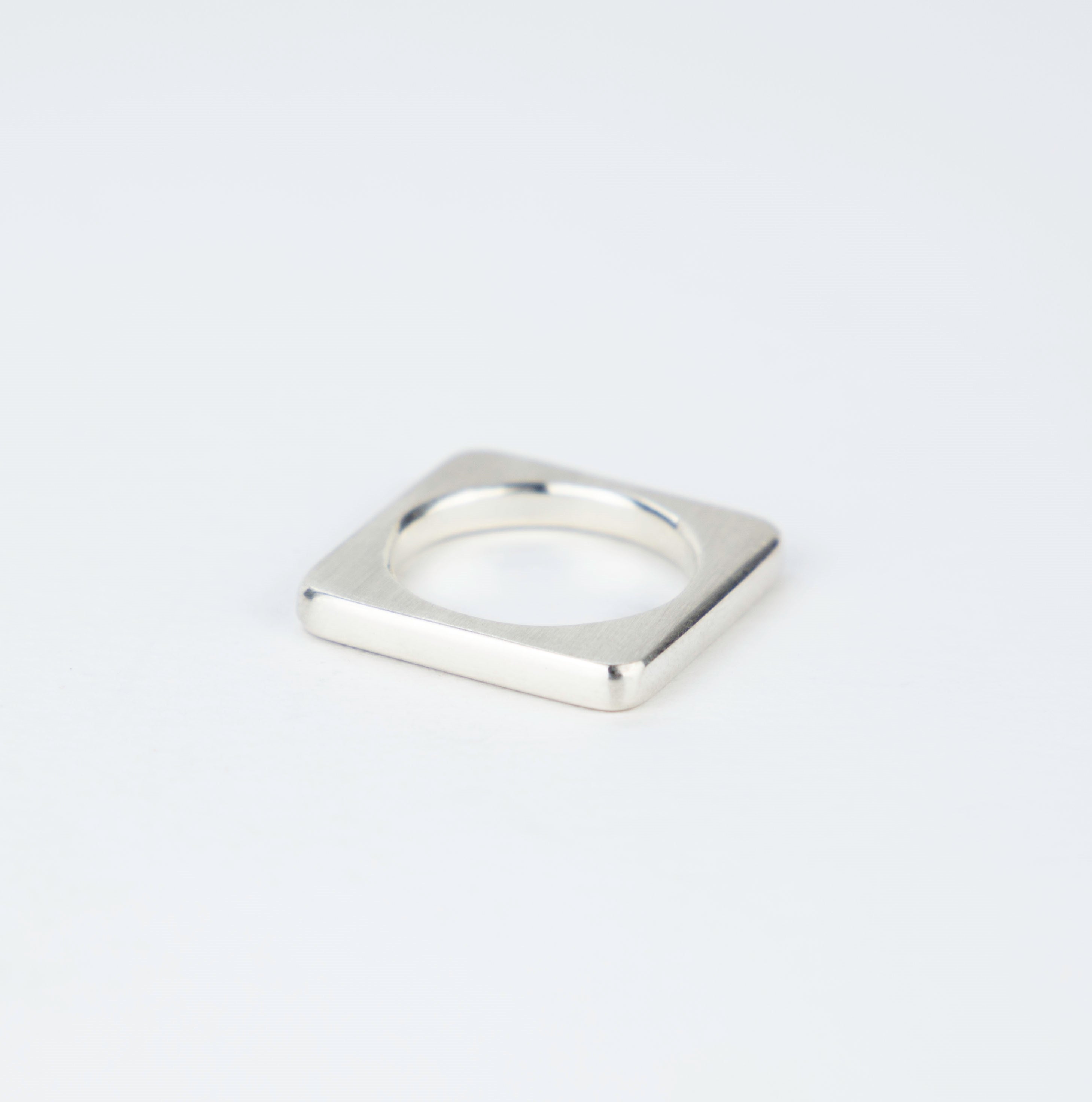 Modern square ring in silver.
